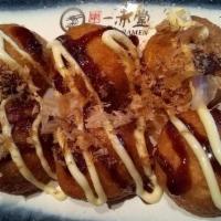 Takoyaki · Fried octopus dumpling, japanese mayo tonkatsu, topped with bonito flakes.