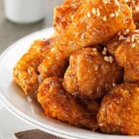 Honey Garlic Wings · A soy-based sauce that is sweet and savory infused with pungent pieces of garlic.