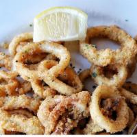 Calamari · Hand breaded tender rings of squid fried golden. Served with cocktail sauce.