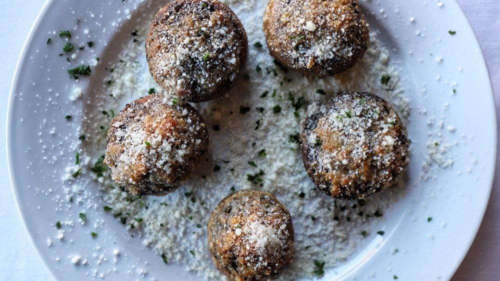 Stuffed Mushrooms · Filled with a blend of Italian sausage, aromatic onions, garlic, herbs and Italian Gaeta olives.