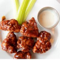 Bbq Boneless Wings · Tender boneless wings in BBQ sauce. Served with celery, blue cheese dressing and blue cheese...