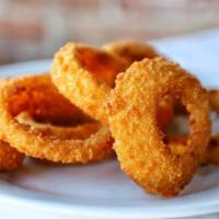 Onion Rings · Homestyle thick cut sweet vidalia onion rings lightly battered and fried golden.