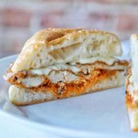 Chicken Parmesan Sandwich · Tender, lightly breaded chicken breast fried to a delicate golden brown then covered in mari...