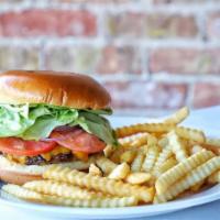 Lucca Burger · Juicy grilled prime burger topped with melted, aged 1-year cheddar cheese, hickory-smoked ba...