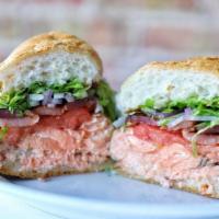 Salmon Club · Grilled salmon fillet, artisanal bacon, avocado, tomatoes, red onions, lettuce and mayo.