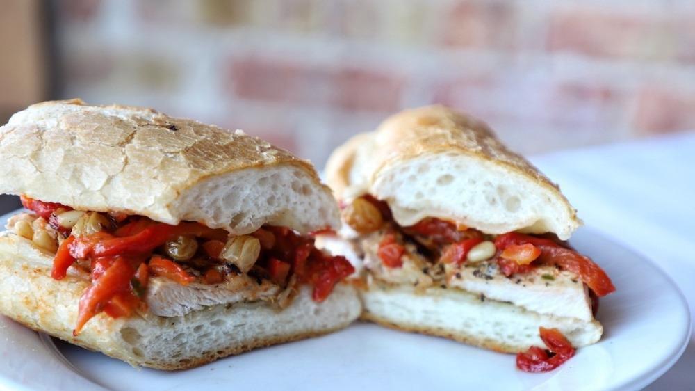 Grilled Chicken Saltimbocca Sandwich · Tender grilled chicken breast topped with provolone cheese and roasted red peppers.