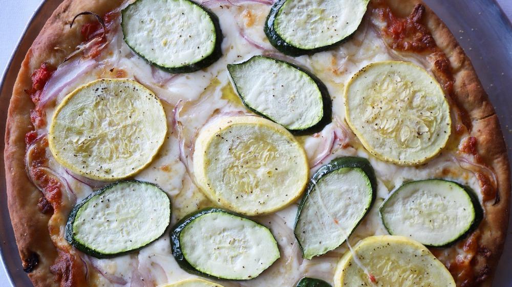 Garden Pizza · Extra virgin olive oil, San Marzano tomatoes, fresh yellow and green zucchini, red onion slivers and California smoked mozzarella cheese.