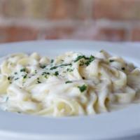 Fettuccine Alfredo · Am angelic bed of fettuccine delicately tossed with creamy Alfredo sauce.