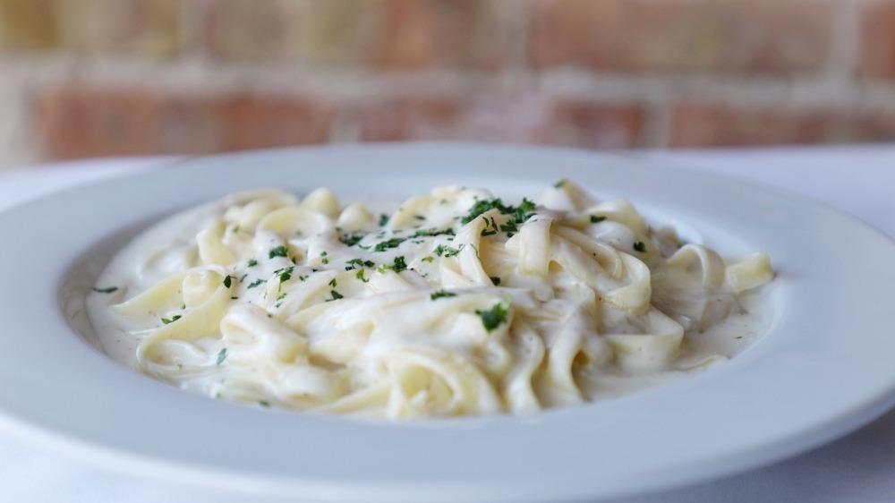 Fettuccine Alfredo · Am angelic bed of fettuccine delicately tossed with creamy Alfredo sauce.