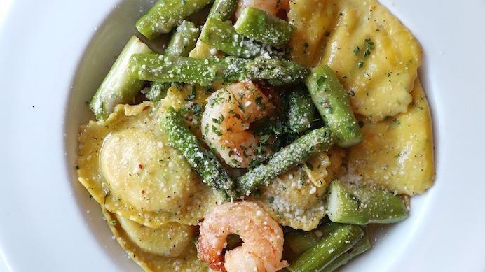 Lobster Ravioli · Ravioli filled with chunky Maine lobster, rock shrimp and cheeses with fresh asparagus and garlic butter sauce.