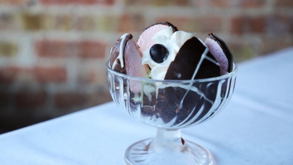 Spumoni · Bomba-strawberry, pistachio and chocolate gelato coated with chocolate and drizzled with white chocolate.