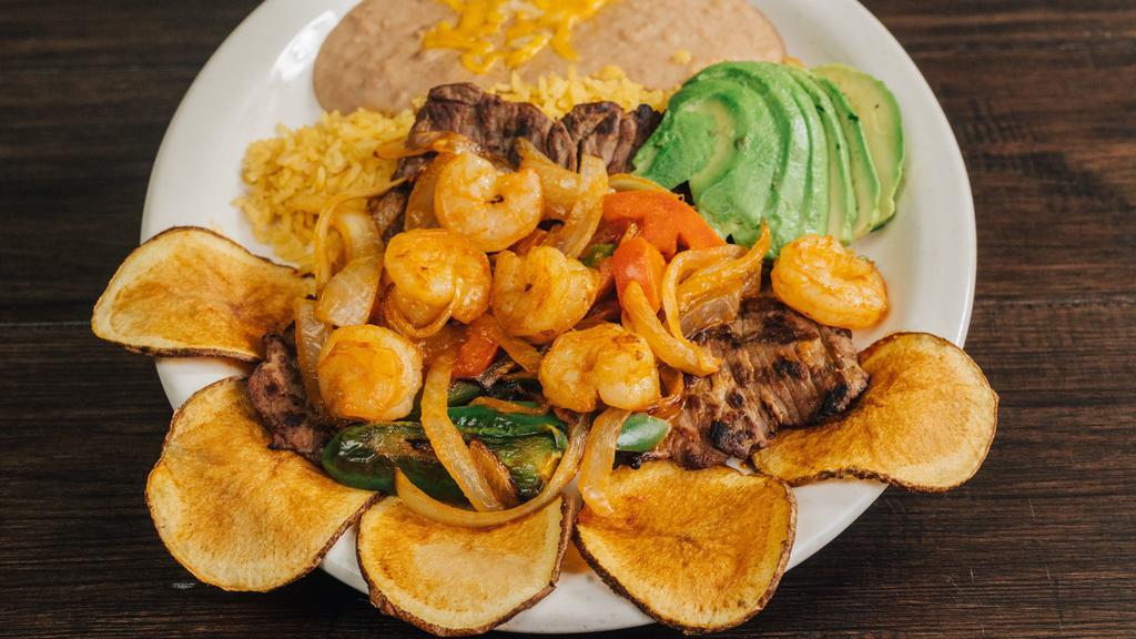 Ranchero Steak & Shrimp · 5 Oz. steak or chicken and six shrimp cooked with onions, tomatoes, jalapenos served with rice, beans, sliced Mexican potatoes, and avocado slices.