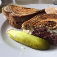 Reuben · Thick sliced corned beef, Swiss cheese and sauerkraut on grilled marble rye bread with thous...