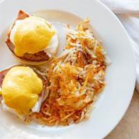 Eggs Benedict · Two poached cage free eggs on an English muffin with all natural ham, crowned with our delic...