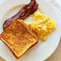 French Toast And Eggs · Includes two cage-free eggs and two pieces of meat  (bacon or sausage). Served with maple sy...