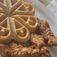 Chicken Tenders And Waffle  · Three pieces home breaded tenders and a waffle, served with butter and syrup.