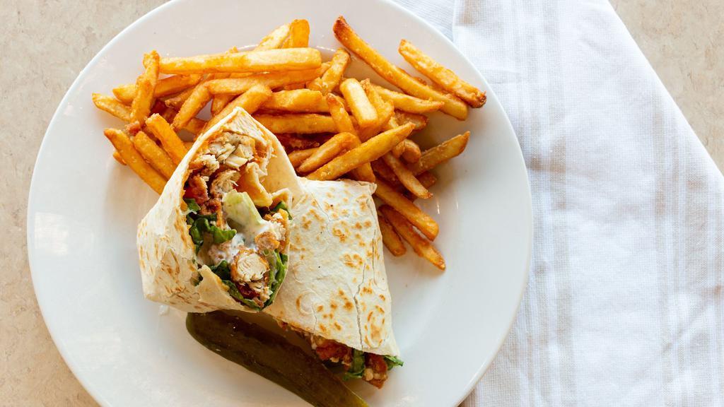 Crispy Chicken Ranch Wrap · All natural crispy chicken strips, shredded lettuce, tomatoes, cheddar cheese and ranch dressing, wrapped in a warm tortilla.