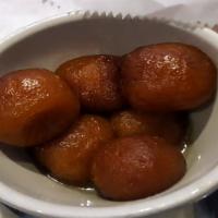 Gulab Jamun · Three pcs. Pastry balls served warm in sugar syrup.