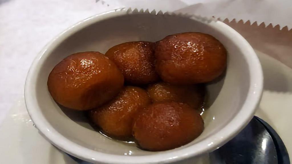 Gulab Jamun · Three pcs. Pastry balls served warm in sugar syrup.