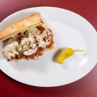 Meatball Parmesan Sandwich · Sandwich with seasoned meat that has been rolled into a ball topped with tomato sauce and ch...