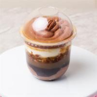 Pecan Delight · Chocolate cheesecake layered with pecans  Carmel and chocolate