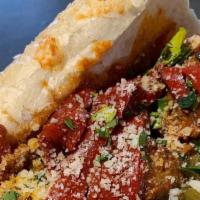 Meatball Sub · Housemade meatballs in marinara sauce with sauteed peppers on a roll