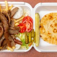 Gyro Dinner · Two pita bread and fries.