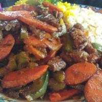 Beef Ghallaba · Pan sauteed beef with carrot, mushrooms, green peppers, onions, and tomatoes. Add hommous fo...