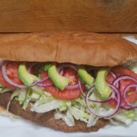 Torta De Milaneza De Res · Breaded Beef filet Mexican Sandwich Accompanied with beans, avocado, lettuce, chili pepper s...