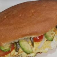 Torta De  Huevo · Scrambled egg Mexican Sandwich Accompanied with beans, avocado, lettuce, chili pepper slices...