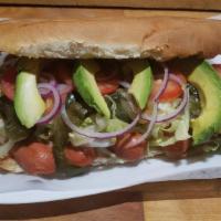 Torta De  Salchicha · Sausage Mexican Sandwich Accompanied with beans, avocado, lettuce, chili pepper slices, toma...