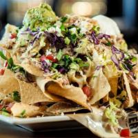 Chopped & Chipped Nachos · Chips, slow-smoked pork shoulder, BBQ sauce, cheese blend, white queso, Cholula® sour cream,...