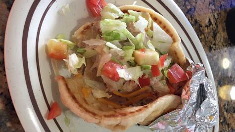 Gyro Sandwich · Served with our gyro sauce, onions and tomatoes.