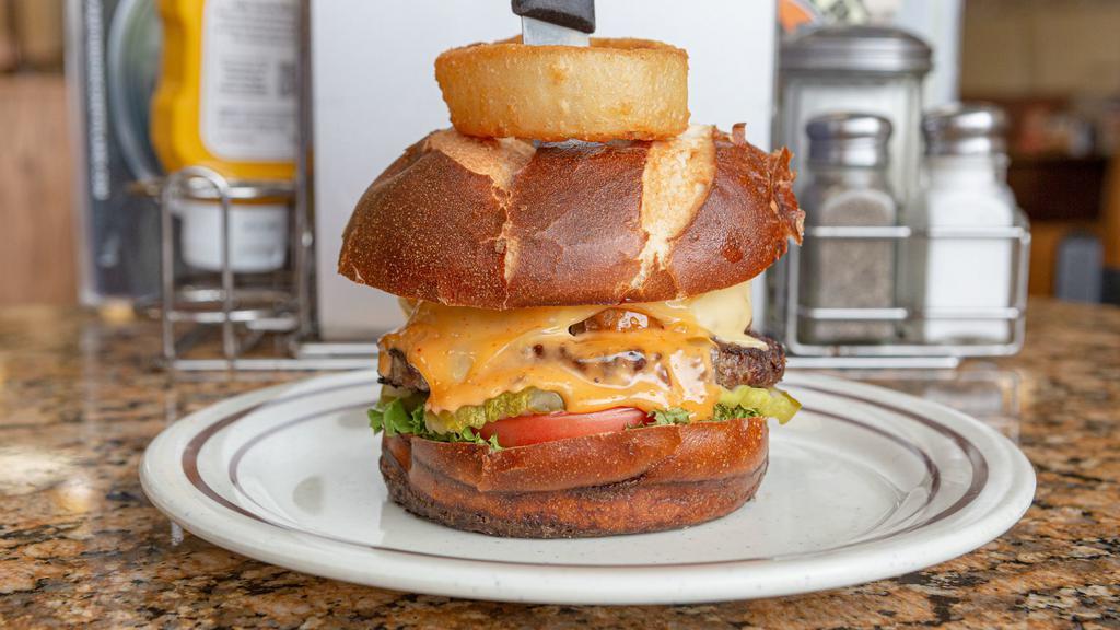 Onion Ring Burger · With lettuce, tomato, pickles, Swiss cheese and onion rings.
Topped with Thousand Island dressing on a pretzel bun.