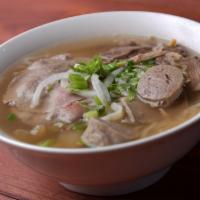 Pho Dac Biet · Rice noodle soup with lean beef, well done flank, beef brisket, tripe and meatballs in a fla...