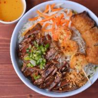 Bun Dac Biet | Noodle Salad · Vermicelli with eggrolls, grilled marinated pork, grilled marinated shrimp with spring green...