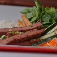 Nem Nuong · Served with rice paper and vermicelli accompanied with pickled daikon/carrots and fresh gree...