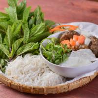 Bun Cha Ha Noi · Seasoned grilled pork patties with thin sliced pork and fried tofu. Served with vermicelli a...