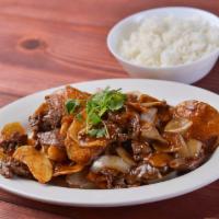 Beef & Potatoes · Beef and crispy potatoes with onions in chef’s special sauce.  Served with stream rice.