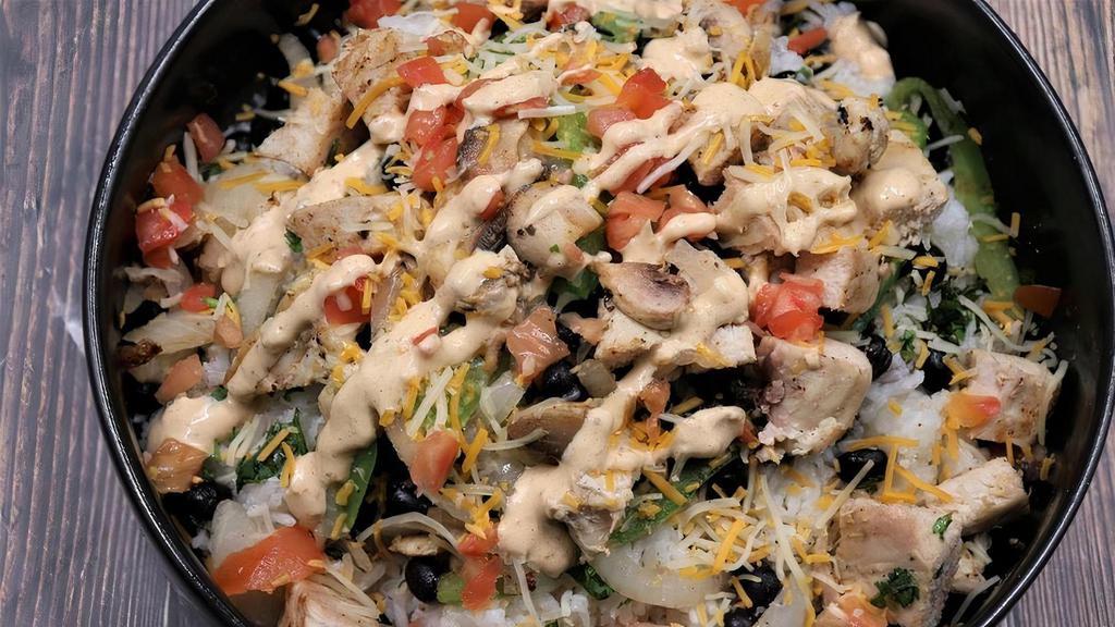 Chicken Bowl · Grilled chicken on a bed of citrus-cilantro rice and your choice of toppings, dressings, and sauces.
