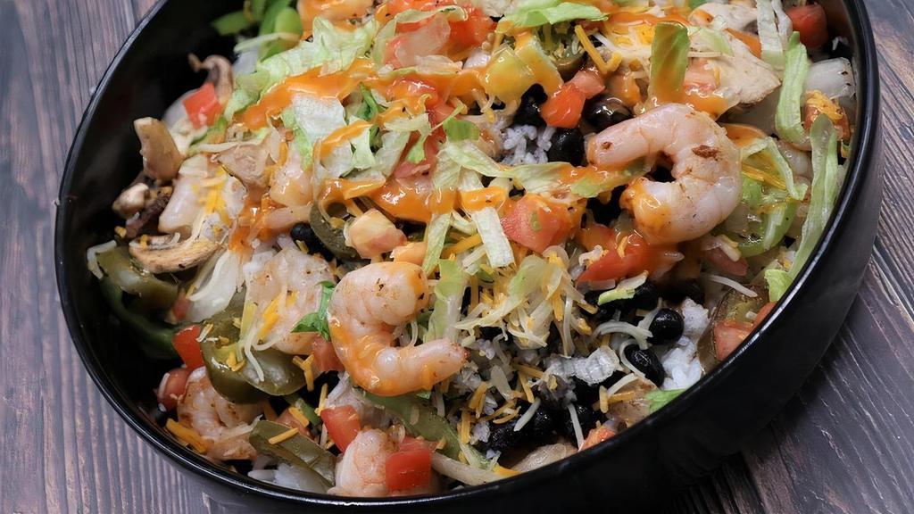 Shrimp Bowl · Grilled shrimp on a bed of citrus-cilantro rice and your choice of toppings, dressings, & sauces.