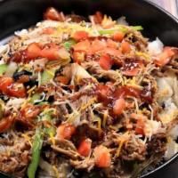 Pork Bowl · Pulled pork on a bed of citrus-cilantro rice and your choice of toppings, dressings, & sauces.