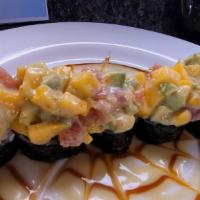 Spiderman Roll · Shrimp tempura with cucumber roll on the bottom, mixed small chunks of tuna ,avocado,mango w...