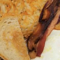 2 Scrambled Eggs · Crispy hash browns or tri-color breakfast potatoes, toast