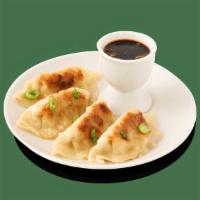 Potstickers · Wok-seared dumplings with chicken and vegetables.