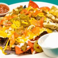 Nachos · Your choice of chips, cheese, meat & veggies. Add cheese, meat, or veggie for an additional ...