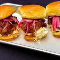 Brisket Sliders · 3 chopped brisket sliders, tossed in our Texas Mop BBQ sauce, topped with coleslaw and PIckl...