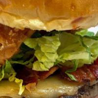 Smoky Burger · 8 oz. Angus beef burger, applewood smoked bacon, smoked mozzarella, chili sauce, lettuce, ga...