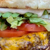 Classic Burger · 8 oz. Angus beef burger, VL Tavern Dijonnaise, lettuce, pickles, and tomato on a brioche bun.