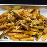 Truffle Fries · French fries tossed in truffle oil and grana padano. Served with a side of garlic aioli.